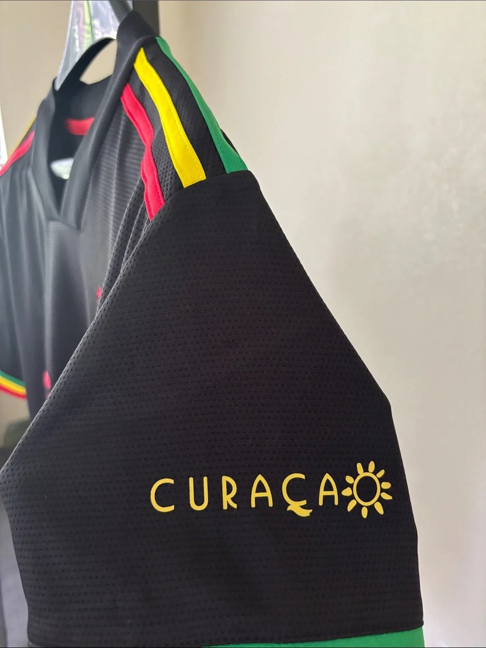 adidas Kids Black Ajax Jersey with Red Logos and Rasta Trim